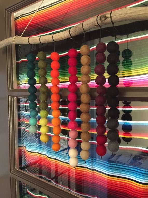 Felt ball wall hanging with driftwood