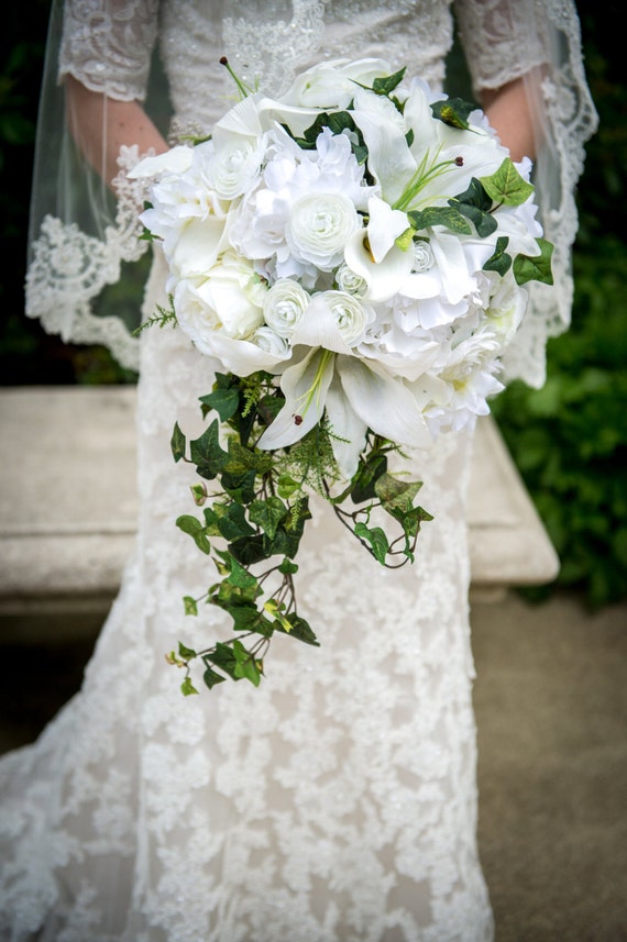 Luxurious fern and ivy cascade bouquet lilies ranunculus