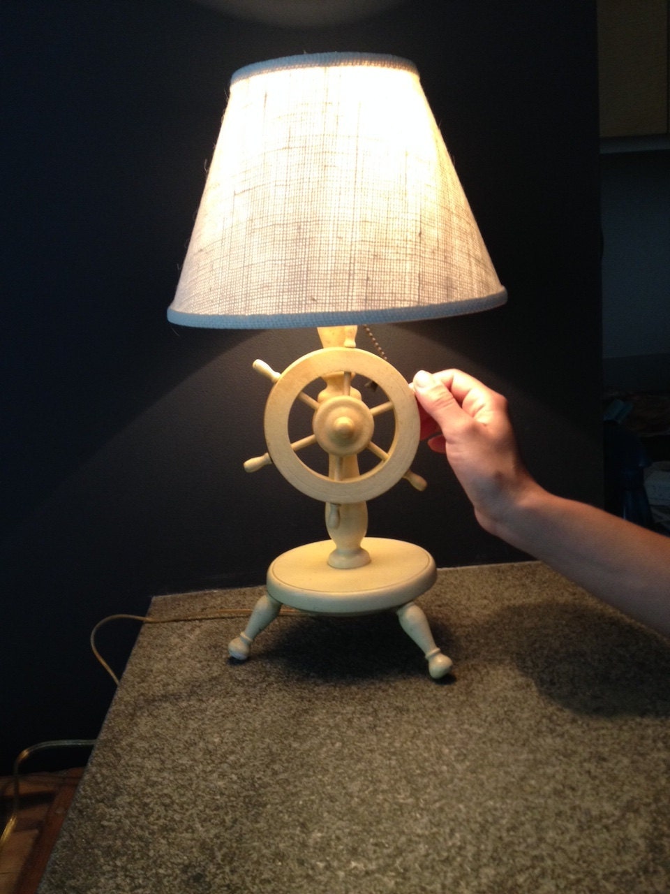 Vintage table lamp turns on by rotating ship's