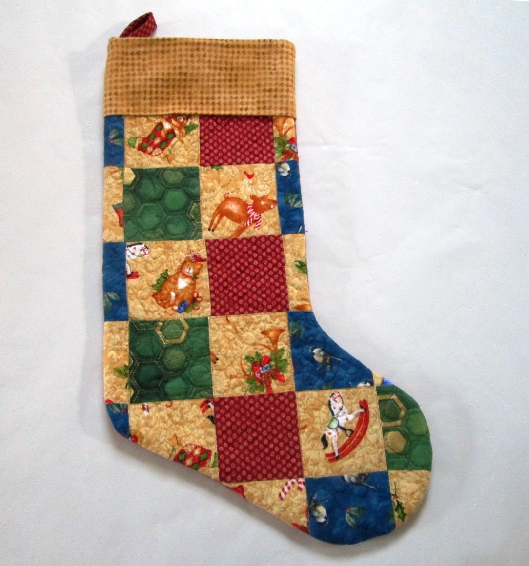 Quilted patchwork Christmas stocking in colorful gold green