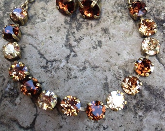 Swarovski crystal brown tone bracelet and earrings