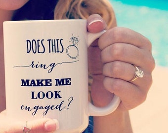 Does this ring make me look engaged? mug. engagement announcement. We're engaged. Engagement ring. Engaged. Fiance. Feyonce