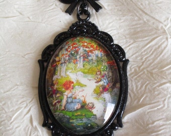 Broche en métal émaillé noir "Une idée de jardin enchanté"