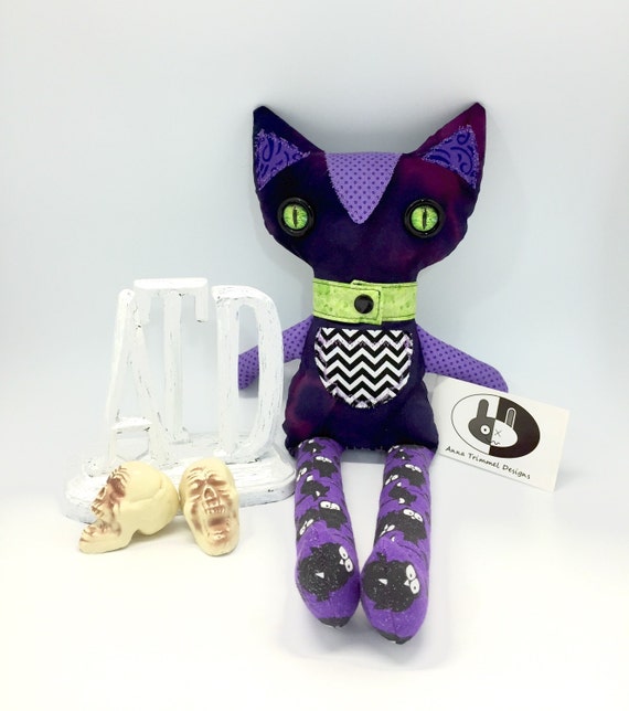 Purple halloween cat with green eyes stuffed plushie