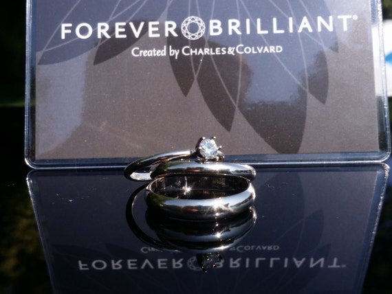 Wedding set, 14k white gold. This is a complete 3 piece 14k white gold wedding set. Included mens band, engagement, and wedding rings.