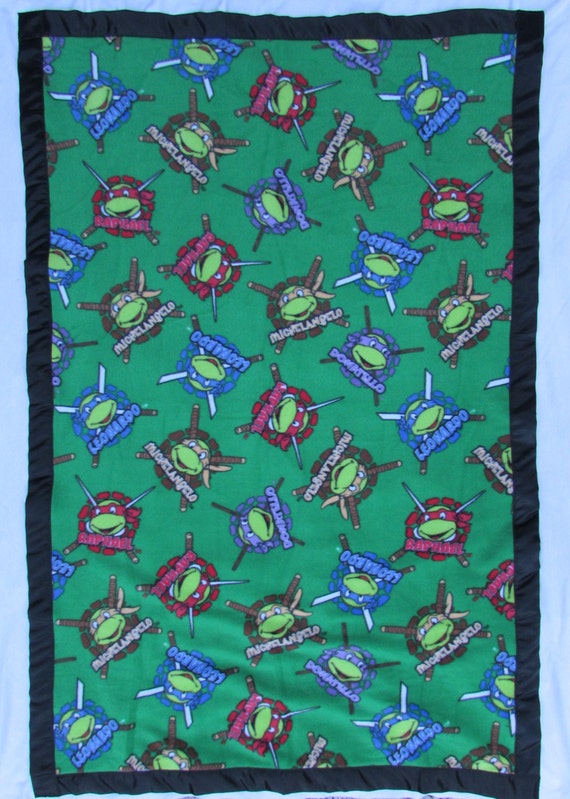Ninja Turtle fleece toddler blanket with satin edge