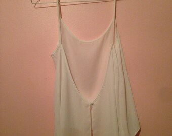Sleeveless sheer white open back top with button closure