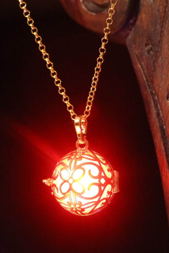 Necklace Golden locket with glowing Orb