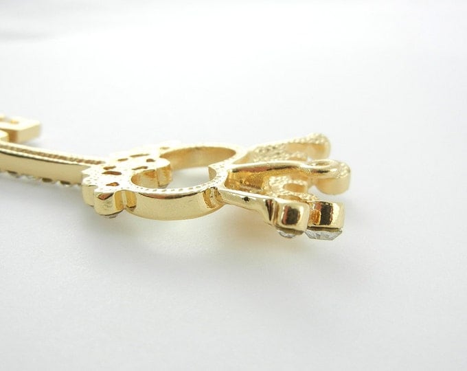 Gold-tone Skeleton Key with Crown Rhinestones