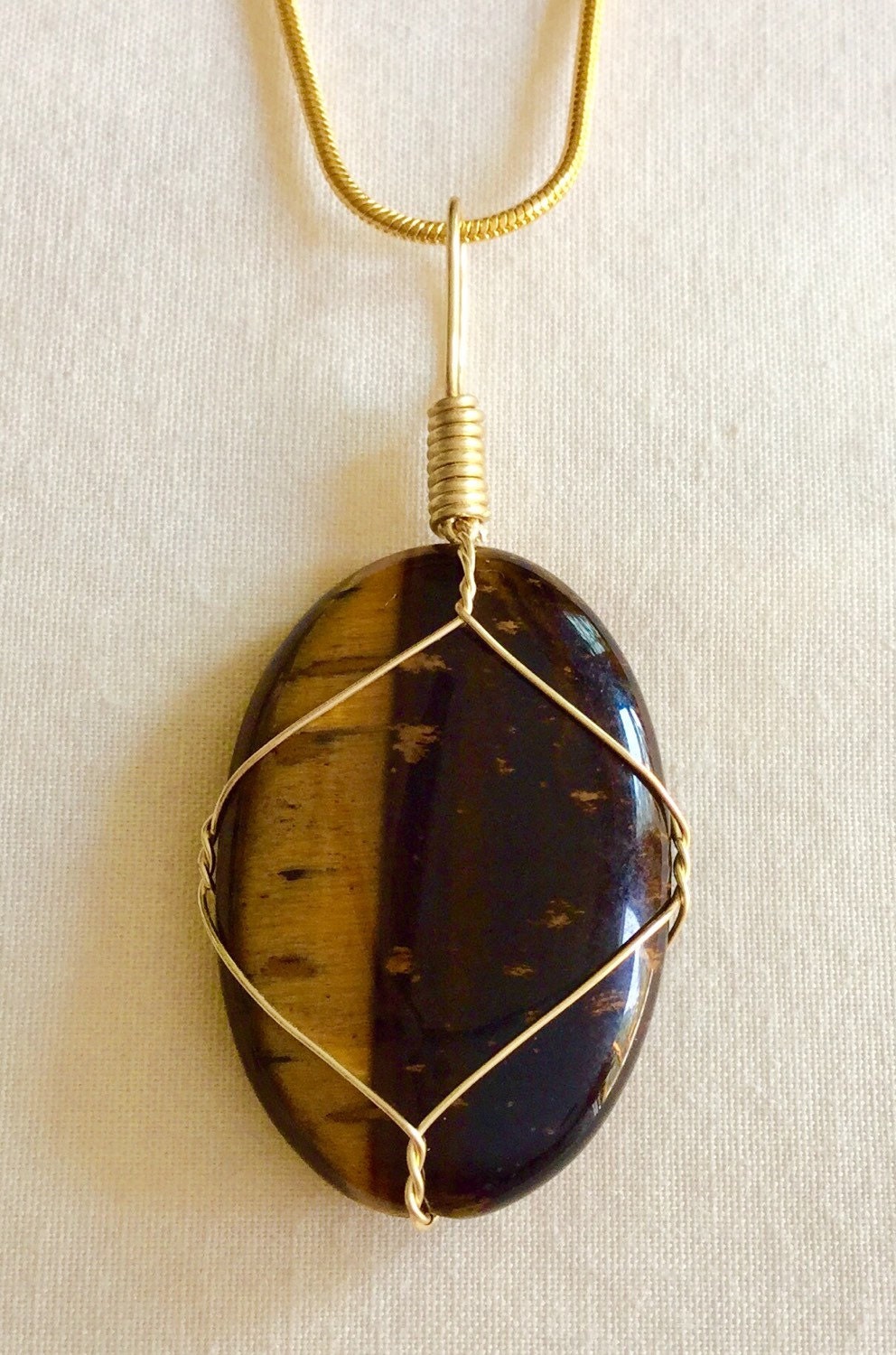 Handmade wrapped Tigers Eye stone pendant necklace.