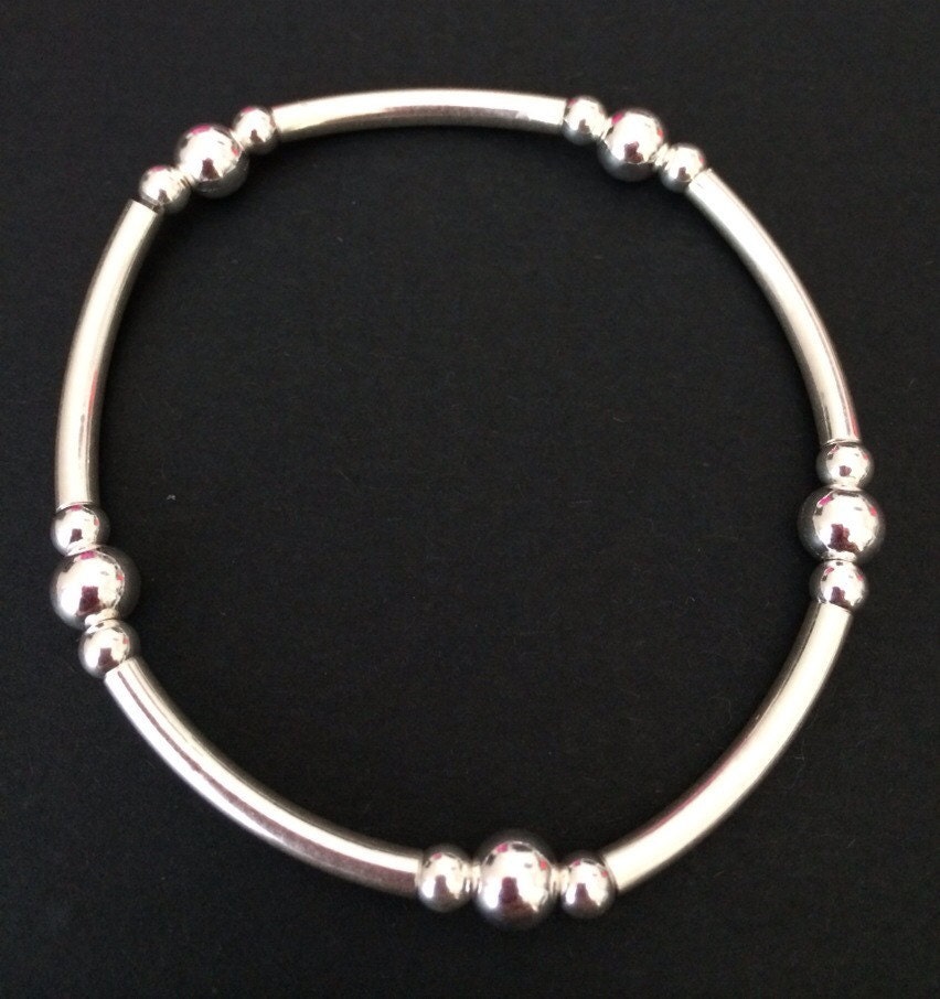 Sterling Silver Stretch Bracelet. Plain Beaded And Tube Beads.