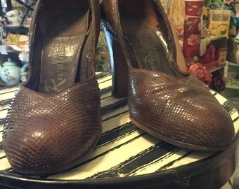 Vintage brown snake skin shoes.