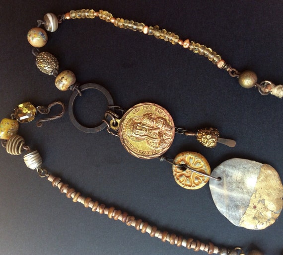 Wayward Wayfarer. Gold colored rustic assemblage Victorian tribal necklace with Mary medal.