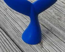 whale tail figurine