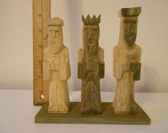 Three mens wise carved wood statue
