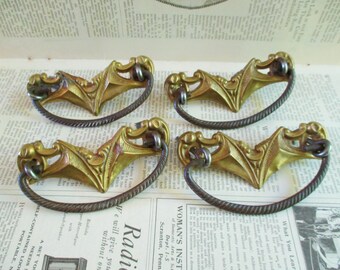 Four Vintage Brass Stamping Drawer Pulls