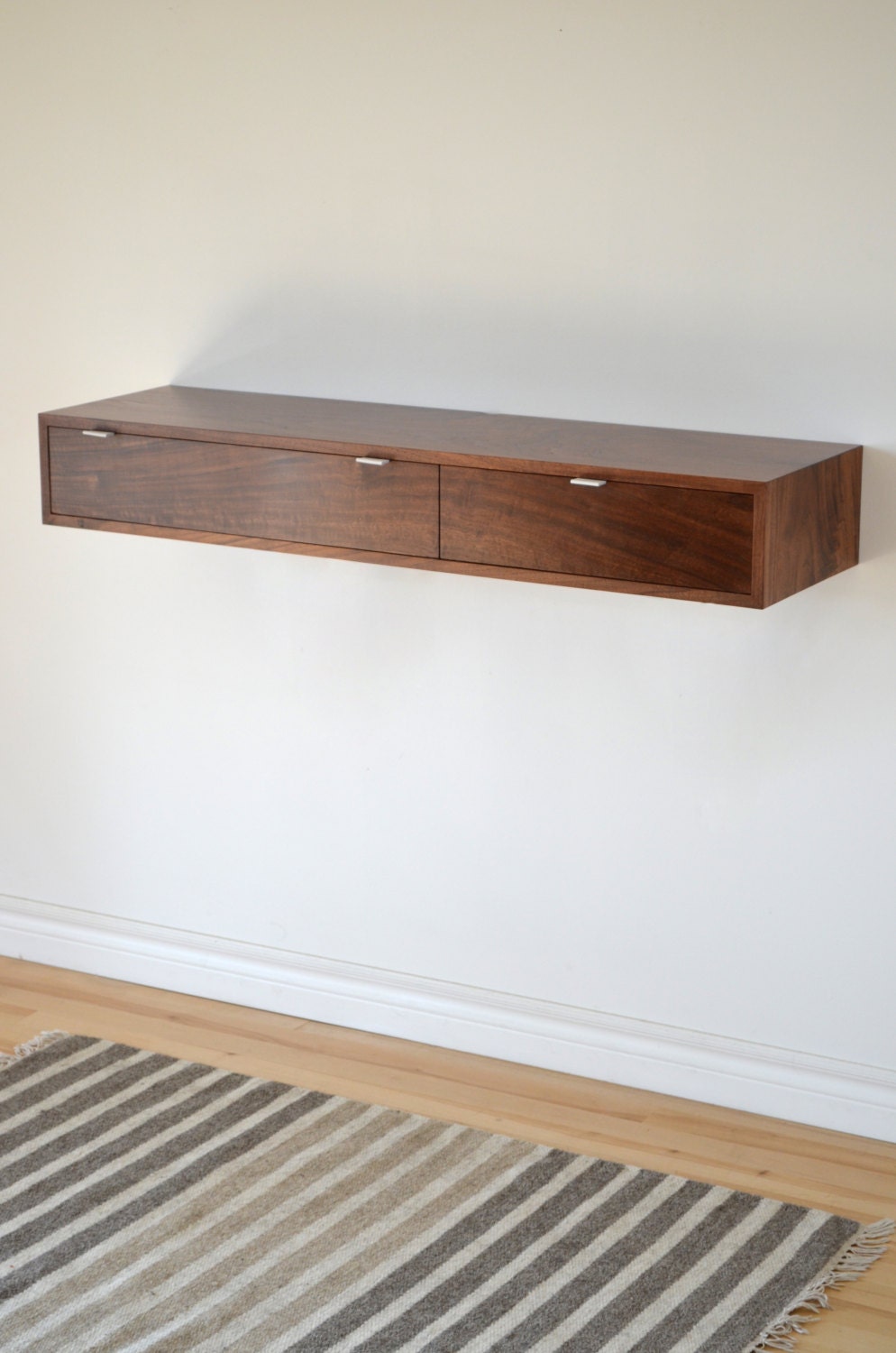 Floating hall table in Walnut