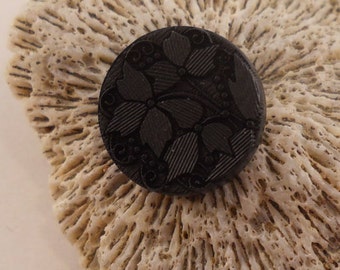 BUTTONS: Black buttons with the look of vintage glass. 5/8 inch, shank, very detailed floral.