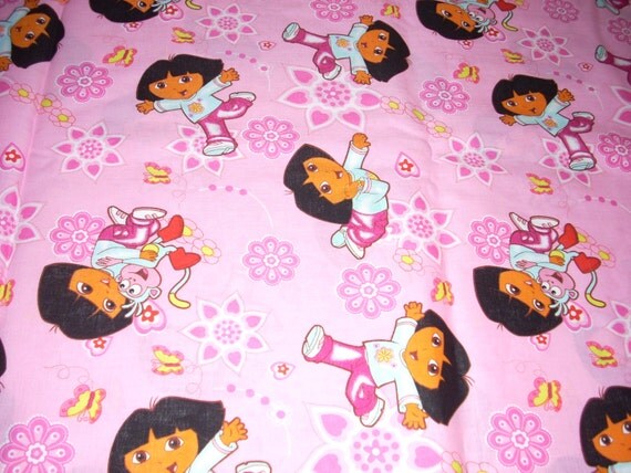 Dora the Explorer on pink cotton fabric 44 wide