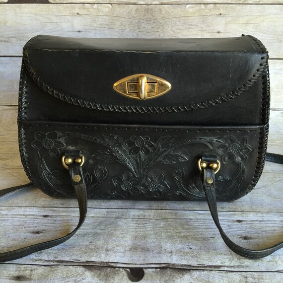 black tooled leather bag