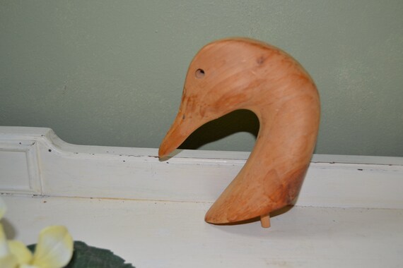 One Vintage hand carved wooden duck head.