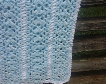 50 x 76 varigated blue with white trim crocheted blanket
