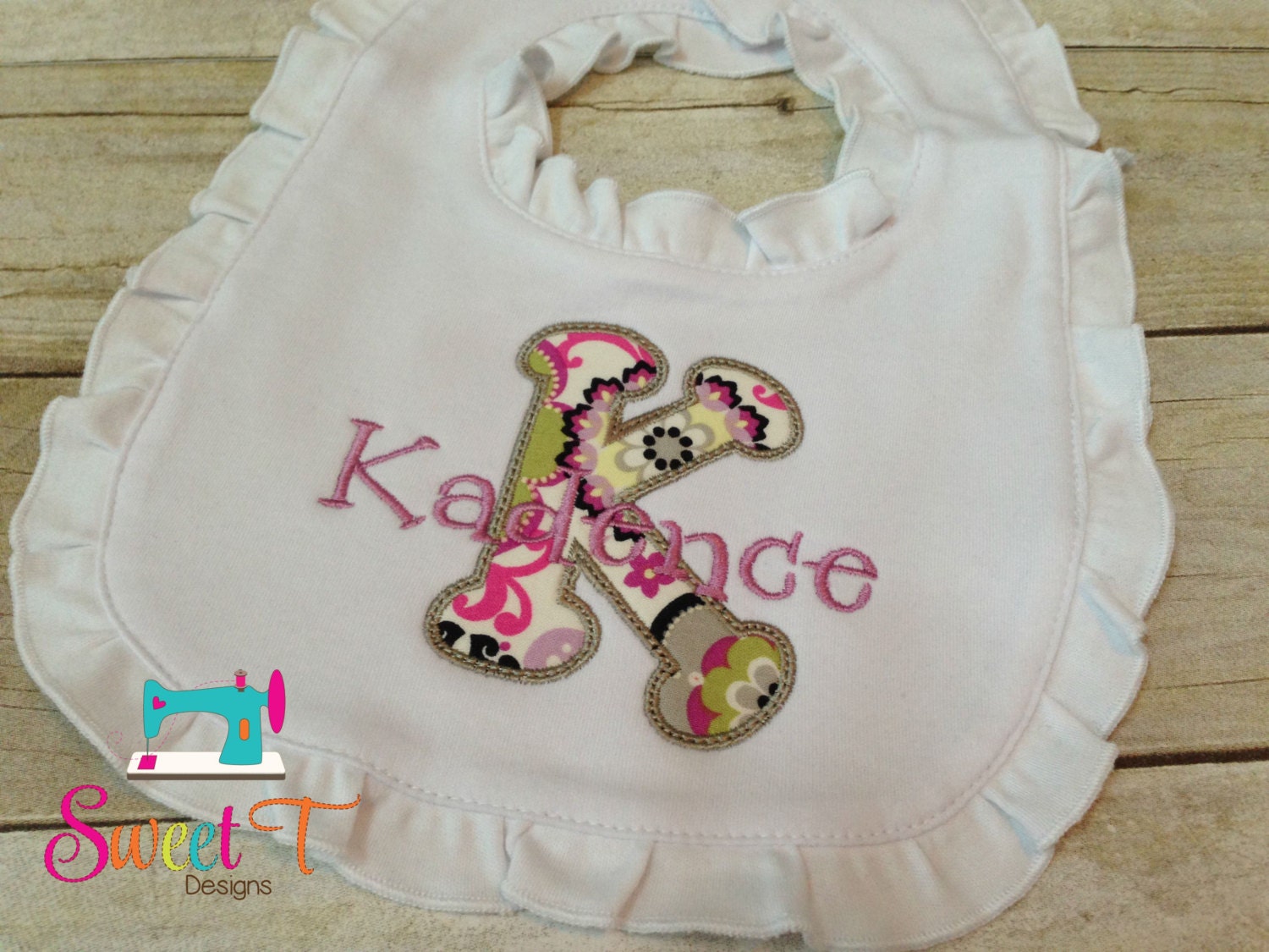 Ogden Nash This gift set of 2 embroidered bibs is made with the finest baby blue pique and trimmed in white rick rack. Each bib is finished with the highest quality monogramming with a single letter to .