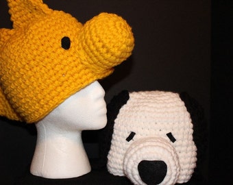2 custom hats - white dog with black ears and a golden bird hat - inspired by Snoopy and Woodstock