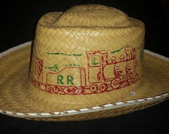 Vintage children's cowboy hat with Rail Road robbery motif