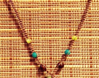 Handmade brown hemp, beaded necklace with pendant