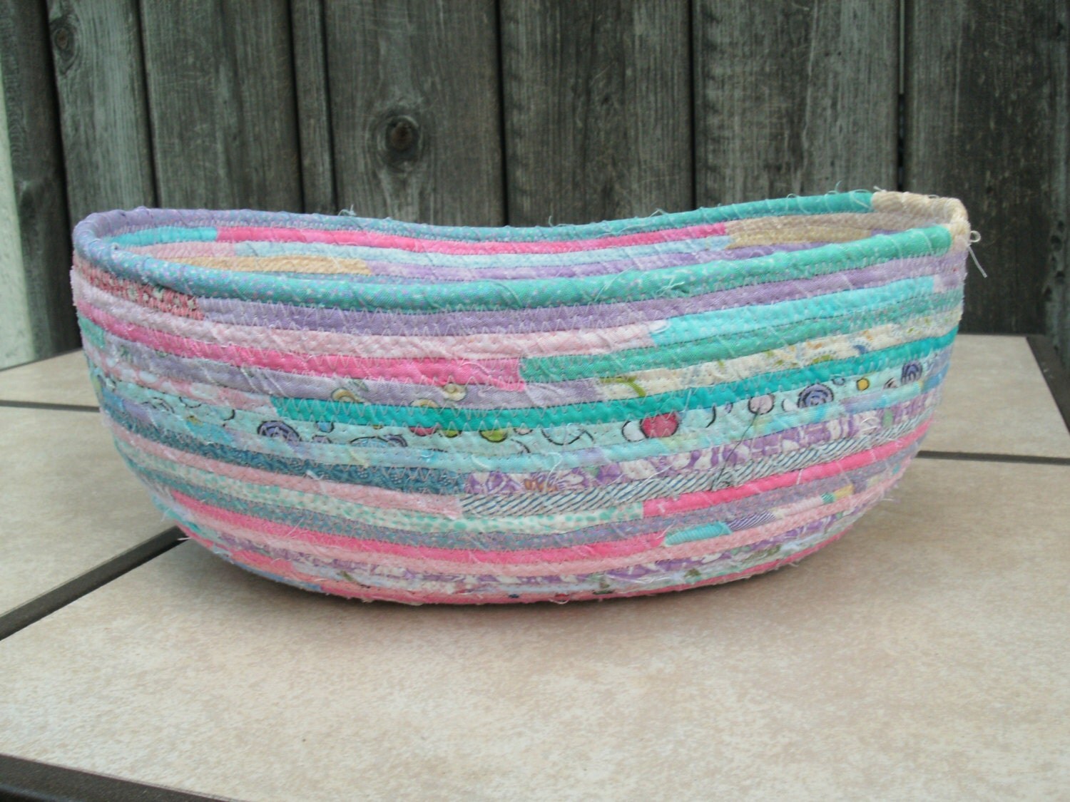 Large oval fabricwrapped coiled rope basket in by timeforquilting