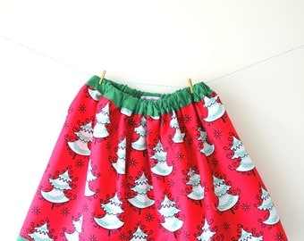 Christmas tree skirt in red with a gorgeous white and green Christmas tree print, fully lined in green with an elasticated waist
