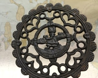 Cast Iron Trivet Dutch Girl and Hearts signed J.Z.H. John Zimmerman Harner 1952