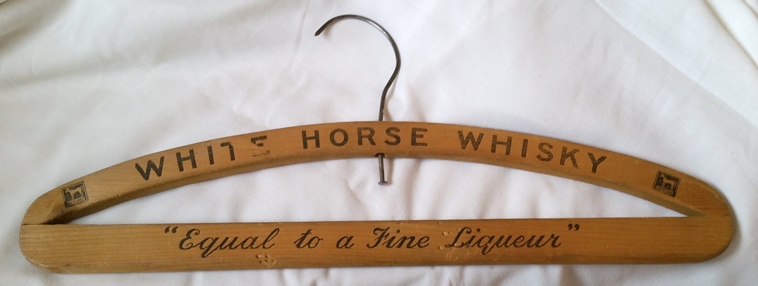 1930s White Horse Whisky Vintage Coat Hanger Advertisement “Equal to a