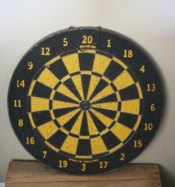 vintage dart board with metal frame made in england by