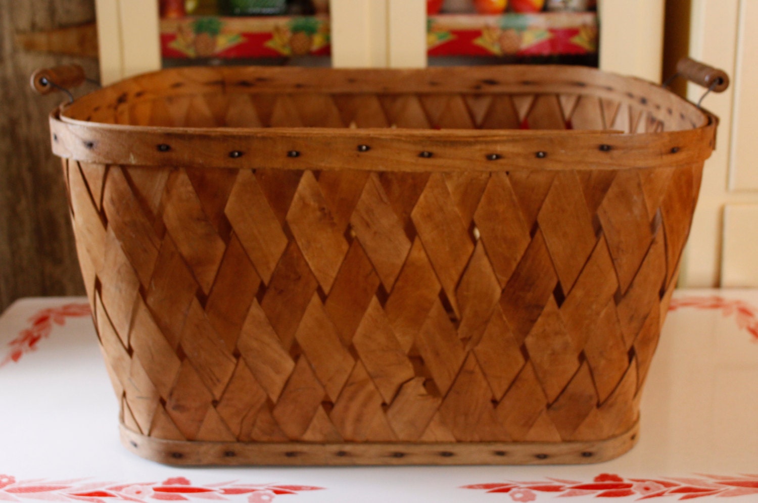 large antique wood woven slat laundry basket with turned wood