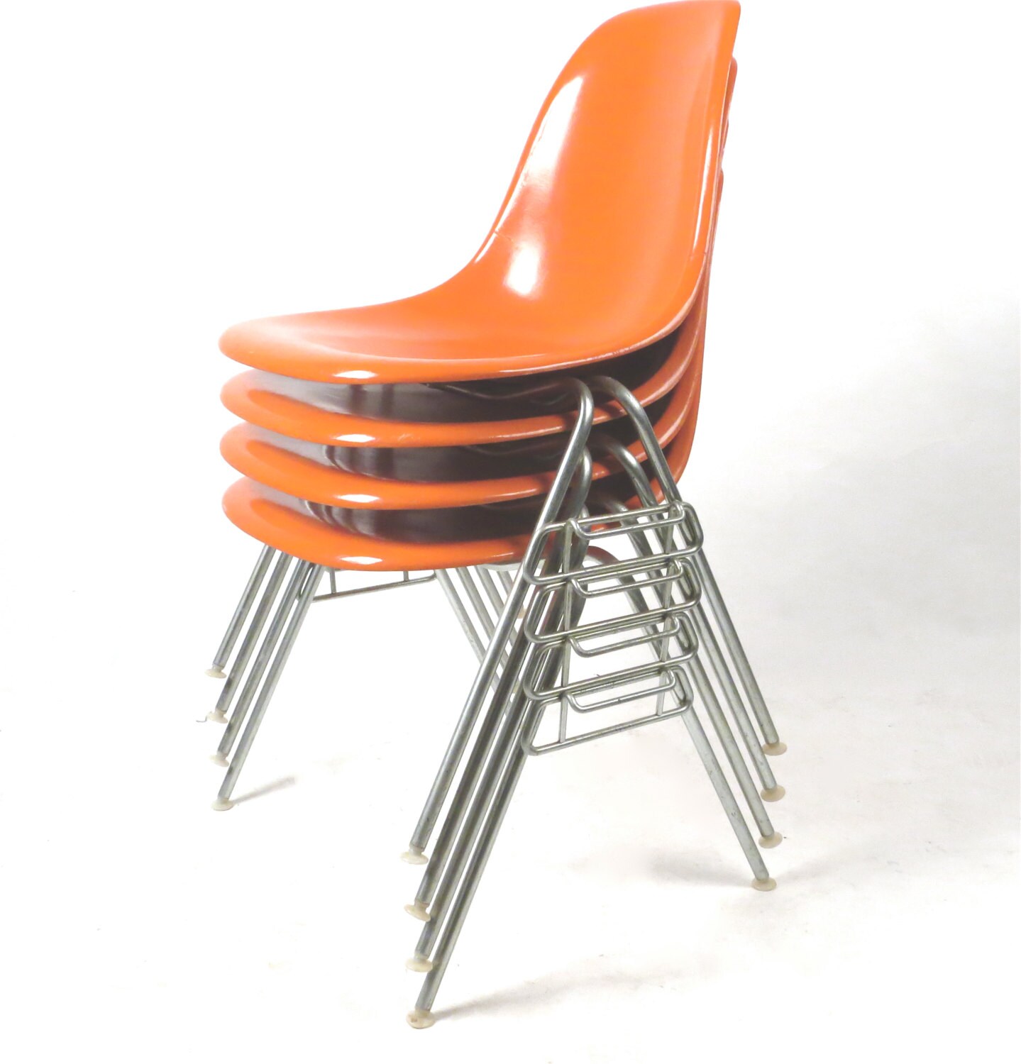 Herman Miller Eames bright orange fiberglass chair set of four Haute