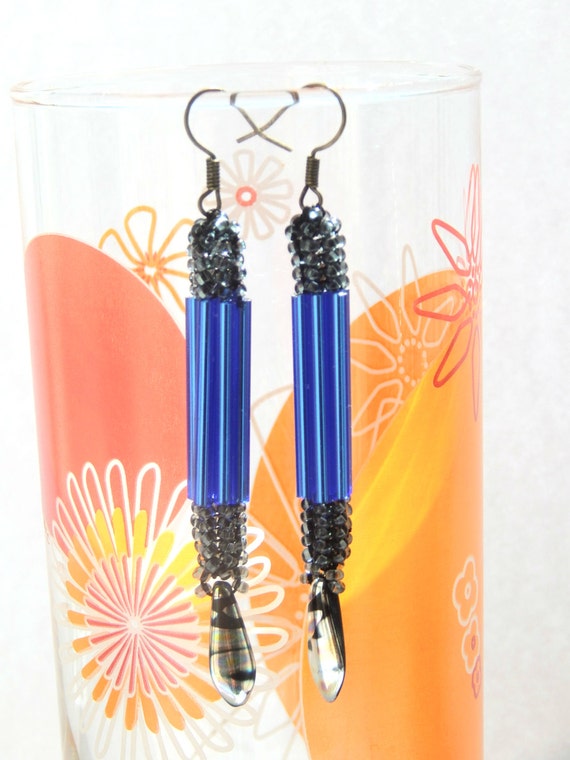 Blue dangle earrings with black sparkly beaded dangling ear