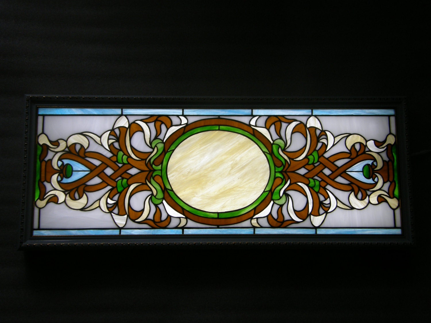 Stained glass panel with backlight to hang on the wall.