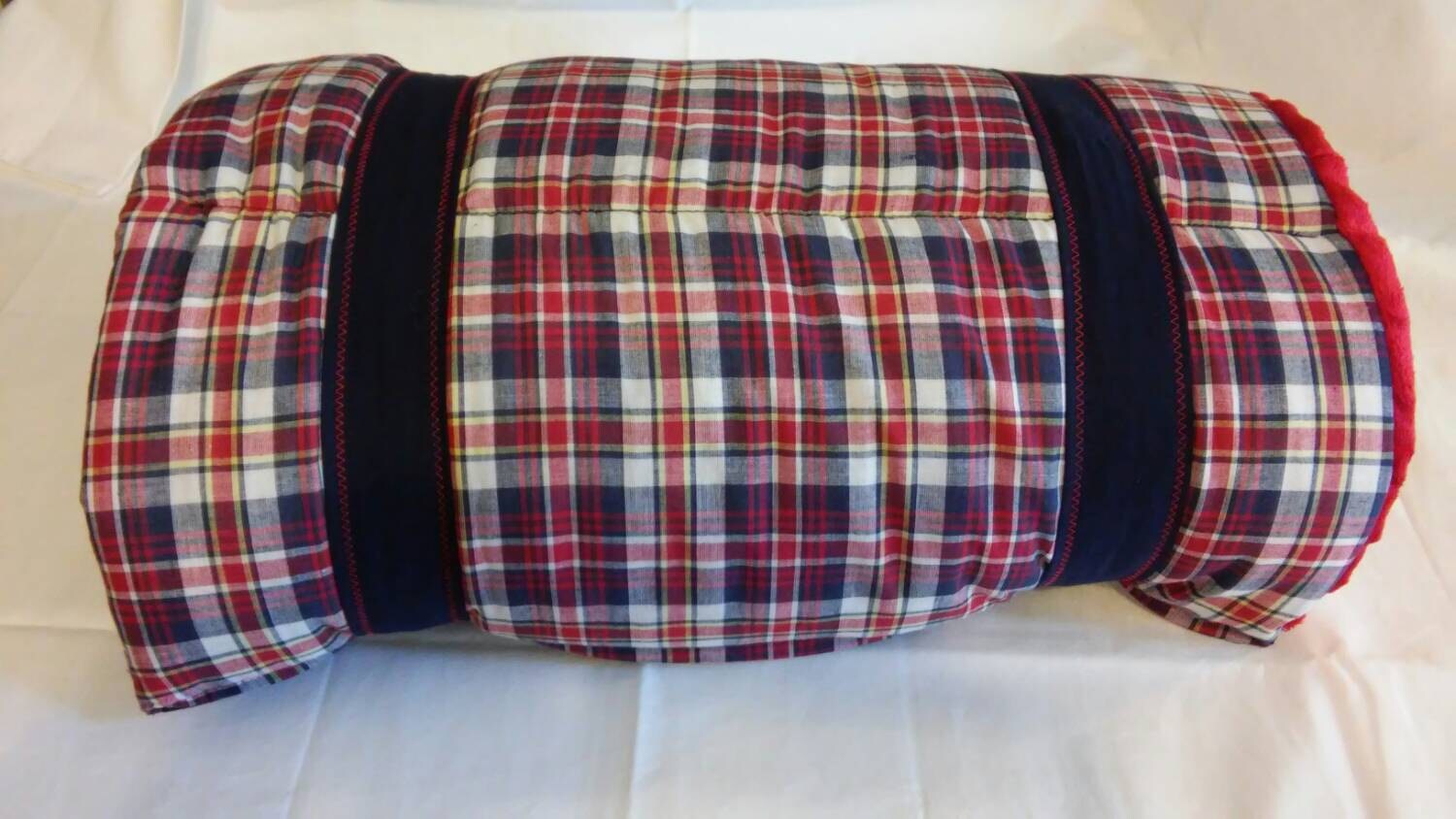 Plaid red and blue nap mat with attached pillow and minkee