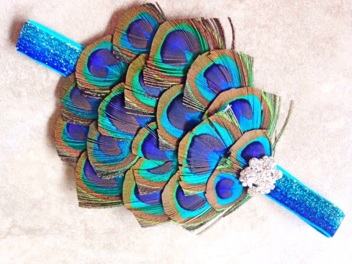1 pcs baby headband peacock feather rhinestone princess peacock headband peacock feather pad headband on a blue 1 pcs baby headband peacock feather rhinestone princess peacock headband peacock feather pad headband on a blue
