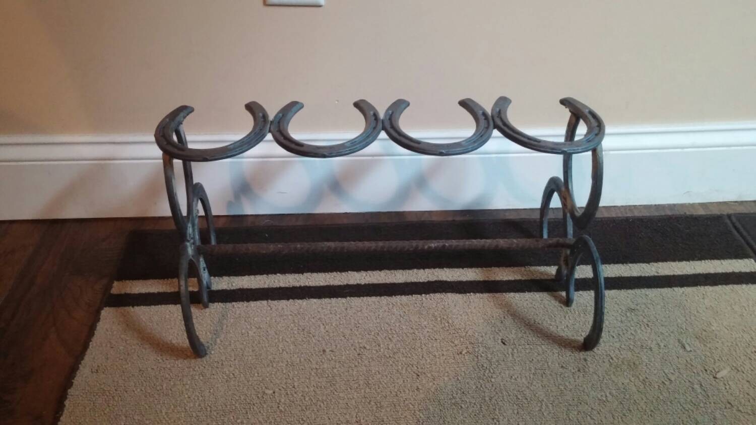 Horse shoe boot rack