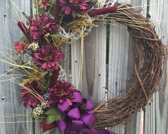 Items similar to SALE!! Holiday Rustic Grapevine Wreath with garland