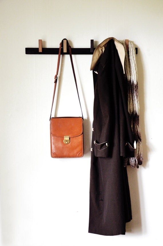 Custom made wooden coat rack in wenge. Movable pins. Can be