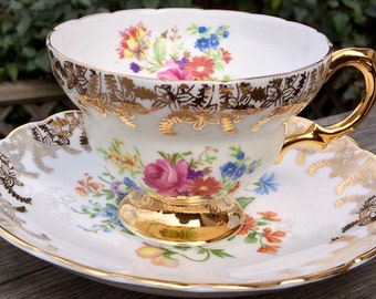 Beautiful Rosina Gold and Floral Footed Teacup and Saucer