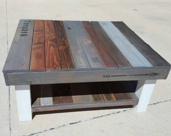 Reclaimed wood coffee table with multi-colored stain and lower shelf. Farmhouse-style, shabby-chic style furniture, fixer upper style