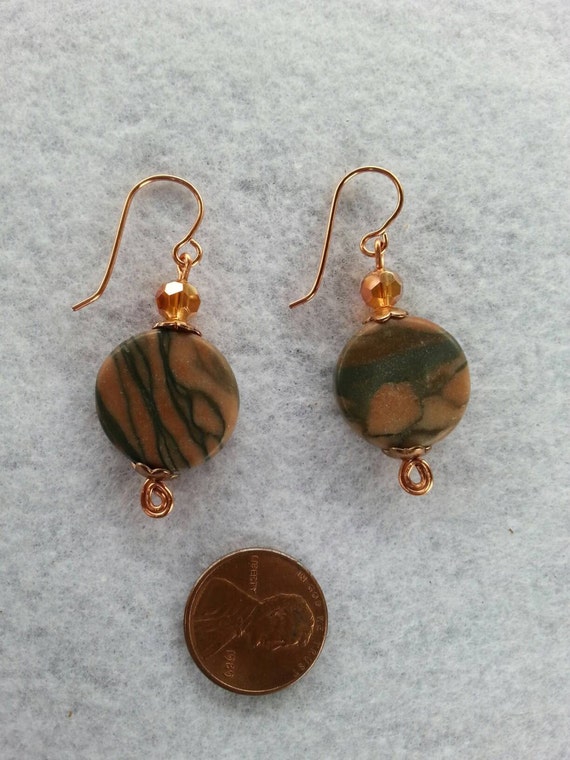 Items similar to Marble rusty brown grey swirl crystal copper earrings