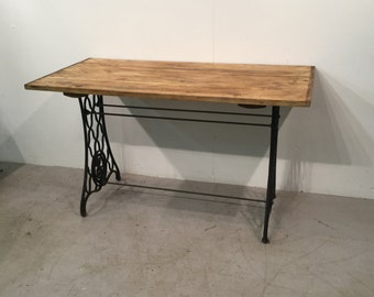 Custom made industrial table on cast iron base