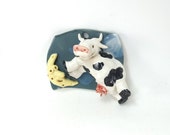 cow over the moon sculpted wall piece