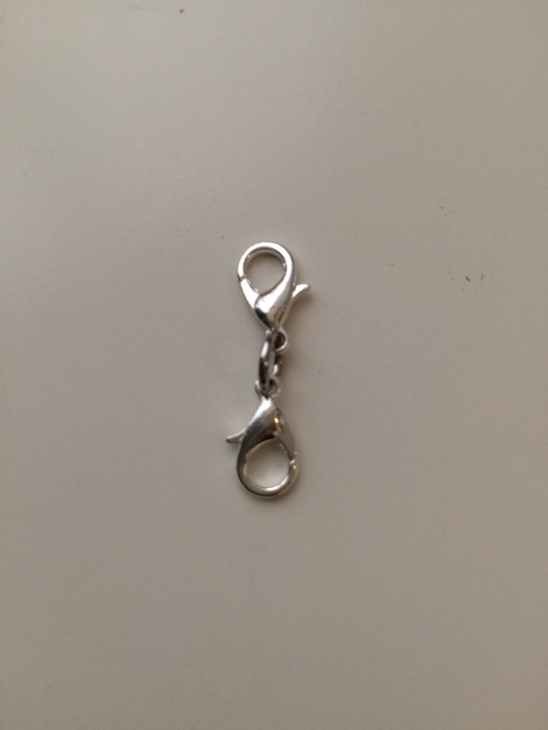 Double sided Lobster clasp as an extender or charm holder.